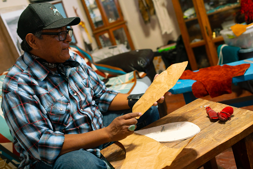 Brent with a foot-tracing he'll use to construct a pair of custom-fit moccasins. JAKE HOYUNGOWA