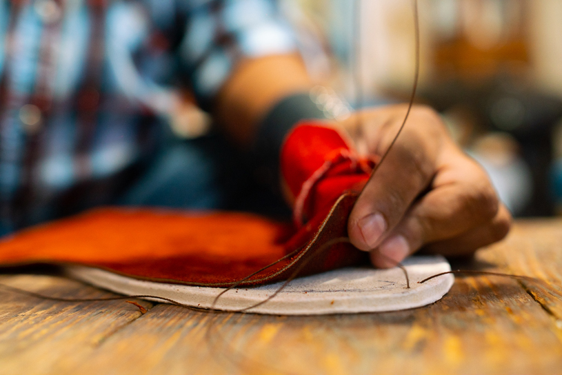 Brent sewing a pair of custom-made moccasins. JAKE HOYUNGOWA