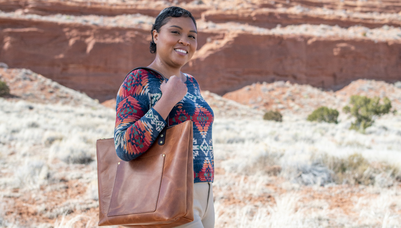 Summer Brown shows off a Lotus & Layne handcrafted tote. Photo by Deidra Peaches