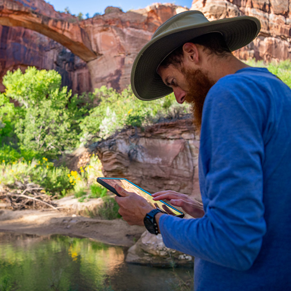 A volunteer records data on an ipad in Grand Staircase-Escalante National Monument