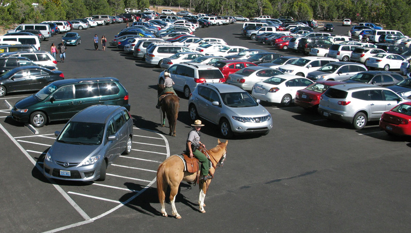 Park rangers patrol an overcrowded parking lot on the South Rim. MICHAEL QUINN, NATIONAL PARK SERVICE