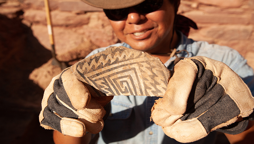 Jason Nez showing off a pottery sherd