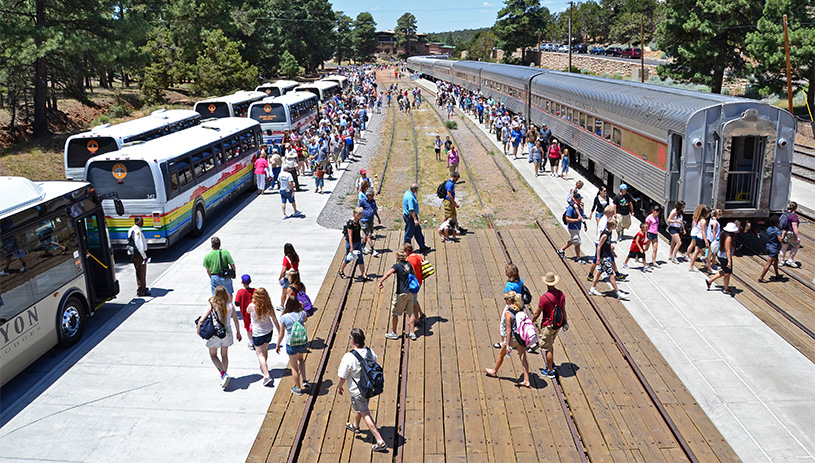 Visitors board buses and trains at the Grand Canyon