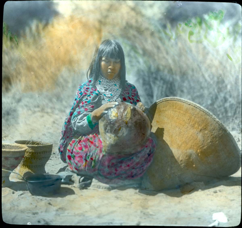 A Havasupai girl applies pitch to a basket, circa 1900. NATIONAL PARK SERVICE