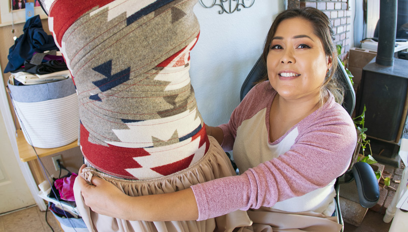 Marisa Mike creates a dress using woven Navajo textiles. Photo by Jake Hoyungowa