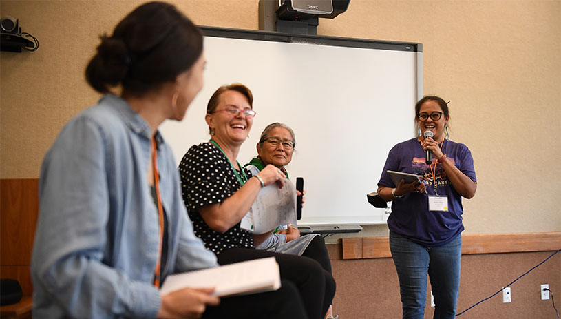 Jessica Stago facilitates a panel discussion