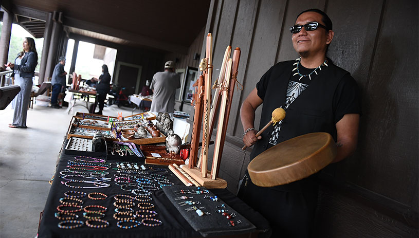 A vendor sells handmade jewelry at Grand Canyon National Park