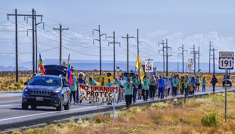 The spiritual walk approaches the White Mesa uranium mill. TIM PETERSON