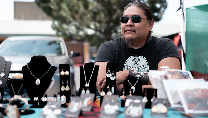 Tom Yazzie displays his work. Photo by Raymond Chee