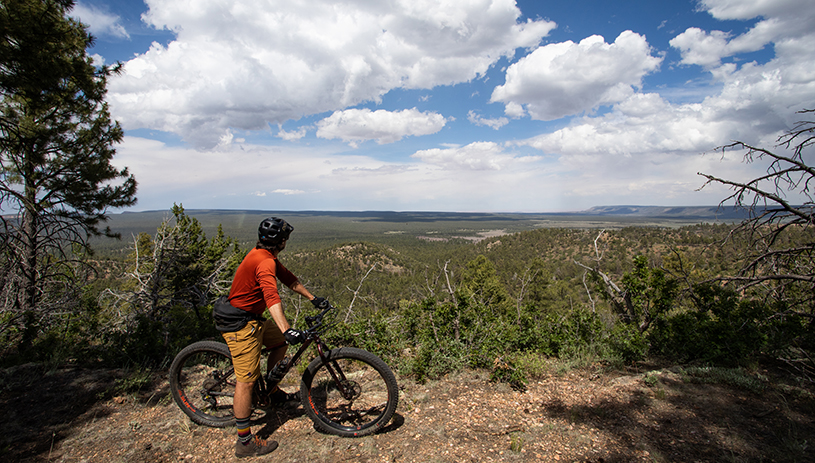 A biker pauses to take in the view in the south section of the proposed monument. Amy S. Martin