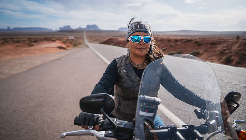 Geri Hongeva on a motorcycle