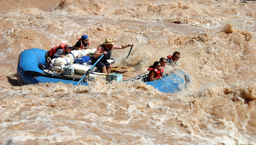 Boaters running Lava Falls Rapid on the Colorado River in Grand Canyon National Park. National Park Service photo by Mark Lellouch.