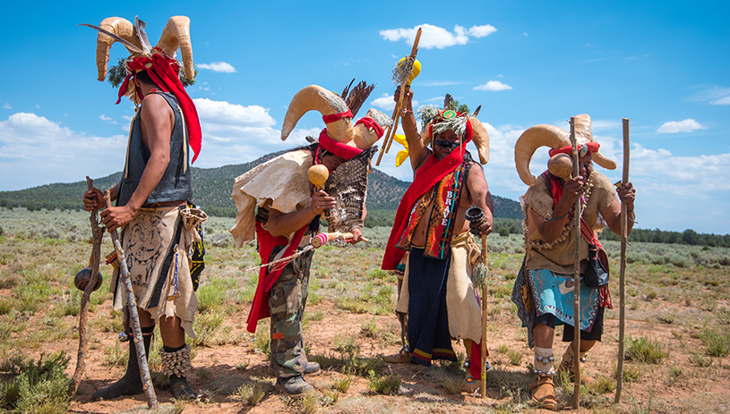 Havasupai dancers in front of their sacred mountain, Red Butte, in the south parcel of the proposed monument. BLAKE MCCORD