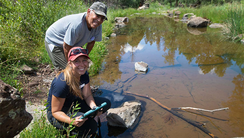 Volunteers survey a spring. 