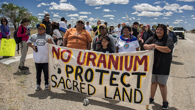 White Mesa Concerned Community members lead a spiritual walk to the mill. TIM PETERSON