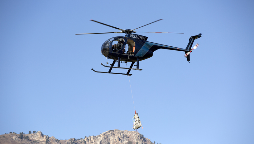 Moving goats by helicopter. MICHAEL CHRISTENSEN, UTAH DIVISION OF WILDLIFE RESOURCES.