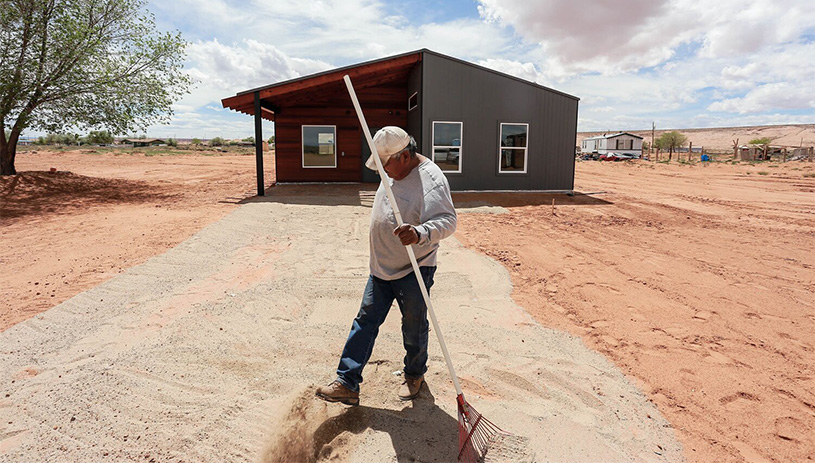 Volunteers help build a house