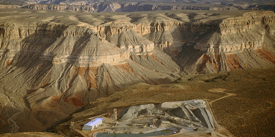 Industrial buildings, pond, roads on edge of the Grand Canyon, Kanab North uranium mine