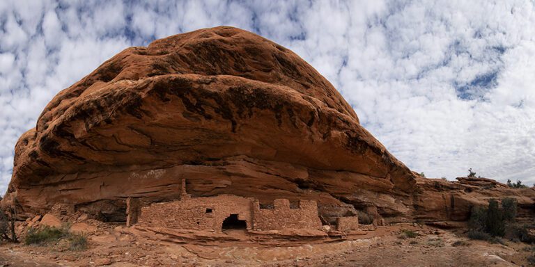 Rock dwelling tucked under a large rock dome in Bears Ears National Monument