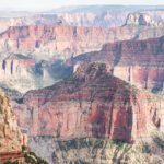 Red rock layers in the Grand Canyon fading out to the horizon.
