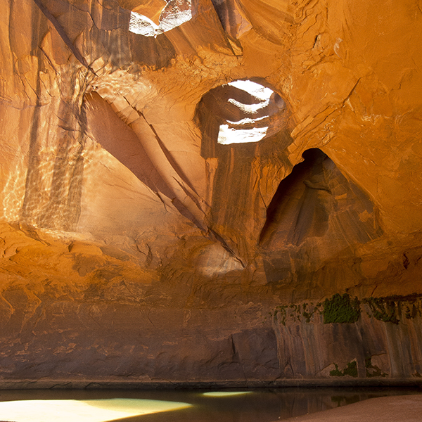 Light pours thorugh the three holes of Golden Cathedral
