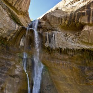 Lower Calf Creek falls pour over a sandstone notch.