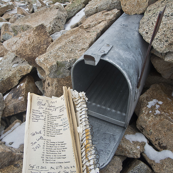 A mailbox and trail log on the Mt. Ellen Summit Trail