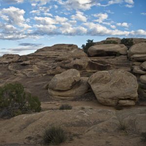 Rock outcrops on top of a slickrock bench