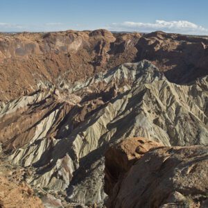 Grey jagged rock inside a red crater