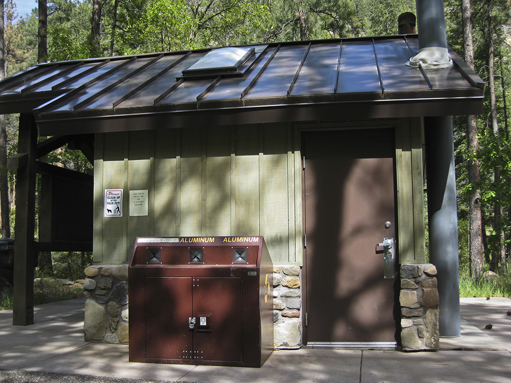 Vault toilets and garbage cans at Pine Flat Campground