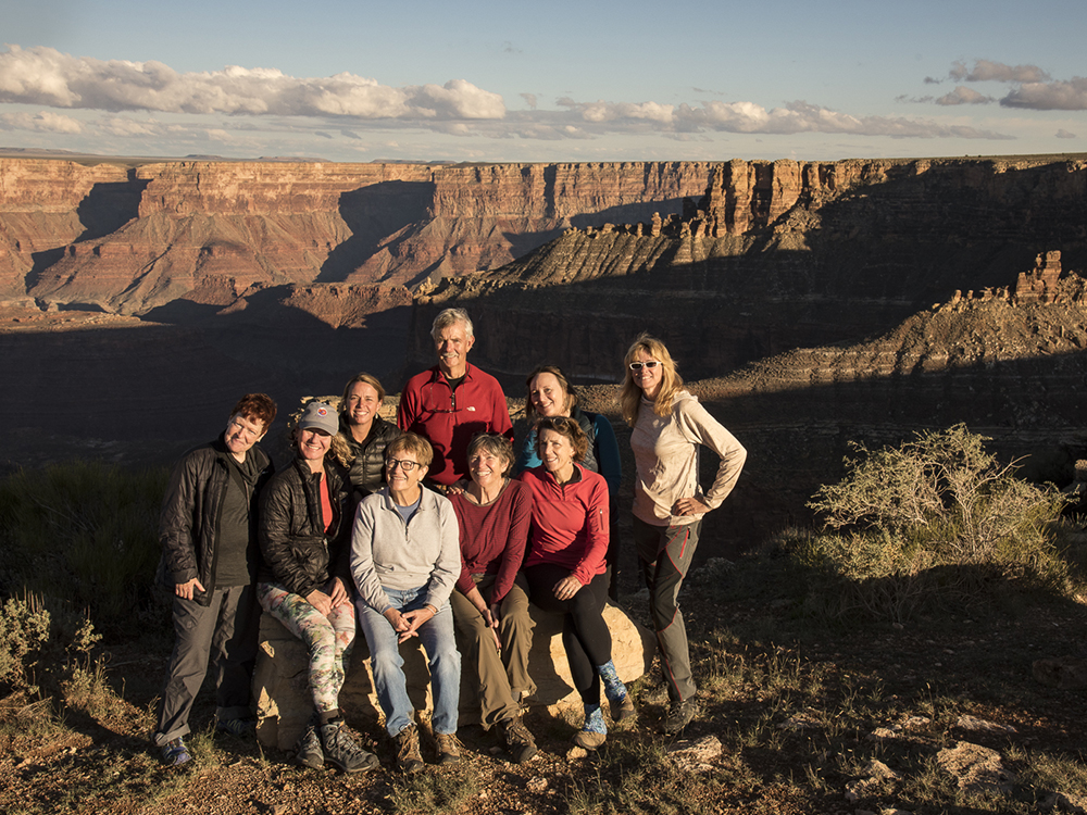 Trust donors pose near the edge of the Grand Canyon in Marble Canyon.