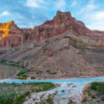 Milky turquoise waters of the Little Colorado River flow into the green-brown mainstem of the Colorado River in the Grand Canyon