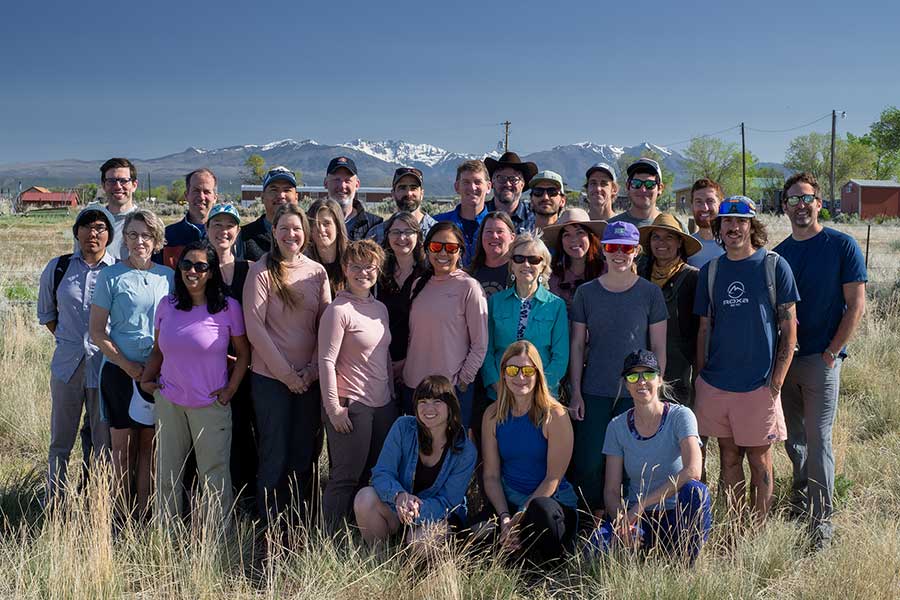 A group shot of Grand Canyon Trust employees with the La Plata mountains in the far distance