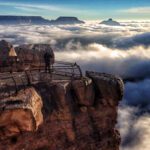 A rare total inversion was seen today by visitors to Grand Canyon National Park. This view is from Mather Point on the South Rim, visitors behind a railing on a rock lookout, Grand Canyon filled with clouds