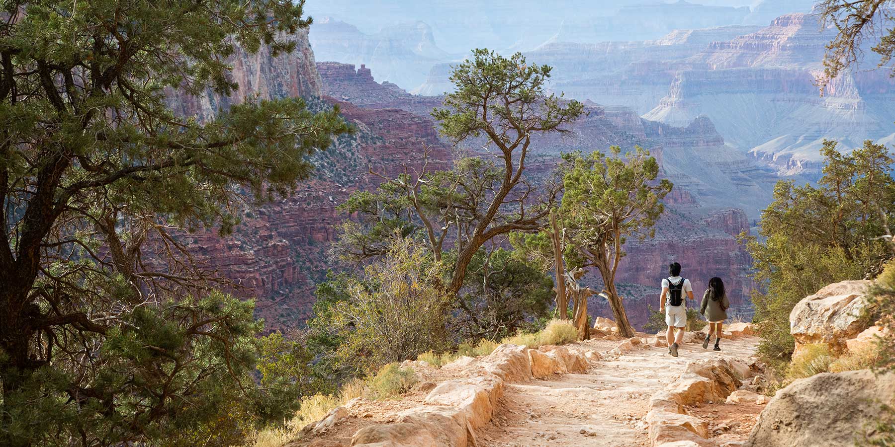Two hikers on the Bright Angel Trail in the Grand Canyon
