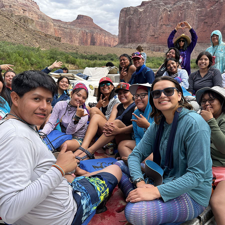 A group of Native youth on a sandbar in the Grand Canyon during a rising leaders RIISE river trip