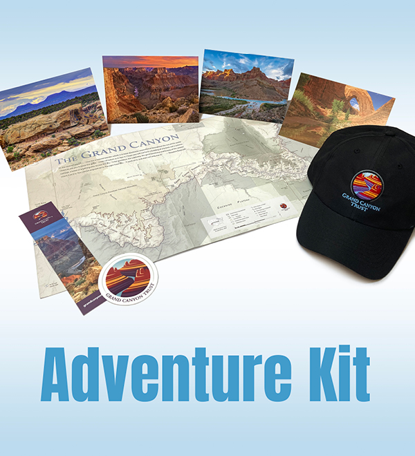 Grand Canyon adventure kit featuring a map, postcards, sticker, bookmark, and a black cap with the logo.
